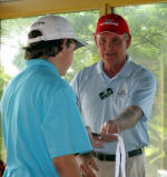 Jonathan receives the 3rd place medal from US Kids Golf Atlanta Tour Manager John Godwin